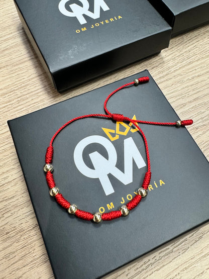 Manilla Tejida 7 Nudos Balín 6mm Oro Laminado 18k | OM JOYERÍA